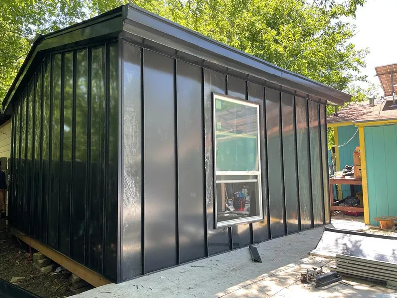 Black standing seam metal wall panels for Metal Roof Installation in Anamosa