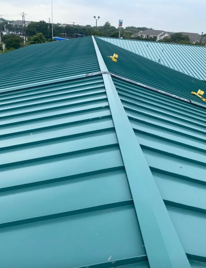 Green commercial metal roof ridge and valley for Metal Roof Repair in Anamosa